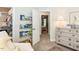 Bright Bedroom with shelving and books, walk-in closet, and neutral tones at 6909 Clear Sailing Ln, Raleigh, NC 27615