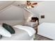 Sloped ceiling bedroom featuring hardwood floors, ceiling fan and two beds at 6909 Clear Sailing Ln, Raleigh, NC 27615