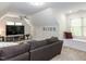 Cozy bonus room with vaulted ceiling, large TV, and window seat at 6909 Clear Sailing Ln, Raleigh, NC 27615
