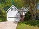 Charming two-story home with a well-manicured lawn and a beautiful shade tree in a desirable neighborhood at 6909 Clear Sailing Ln, Raleigh, NC 27615