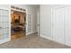 View of the living room and kitchen, featuring a comfortable sofa, hardwood floors, and an open floor plan at 6909 Clear Sailing Ln, Raleigh, NC 27615