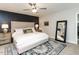 Beautiful main bedroom with a dark accent wall, soft lighting, and a spacious layout at 6909 Clear Sailing Ln, Raleigh, NC 27615