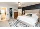 Well-appointed main bedroom featuring a walk-in closet, soft lighting, and a stylish decor at 6909 Clear Sailing Ln, Raleigh, NC 27615