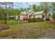 Exterior view of home featuring metal roof and fenced front yard and garden at 7110 Hunter Hill Rd, Rocky Mount, NC 27804