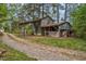Rustic outbuilding with weathered corrugated metal and attached sheds at 7110 Hunter Hill Rd, Rocky Mount, NC 27804