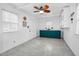 Room with white walls, tile floors, a ceiling fan and built in green cabinets at 7110 Hunter Hill Rd, Rocky Mount, NC 27804