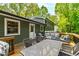 Inviting back deck featuring comfortable seating and a dining area, perfect for outdoor gatherings and relaxation at 7409 Fiesta Way, Raleigh, NC 27615