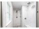 Tiled walk-in shower features both a rain shower head and handheld sprayer at 7409 Fiesta Way, Raleigh, NC 27615