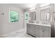 Bathroom features a double vanity with modern fixtures and marble floors at 7409 Fiesta Way, Raleigh, NC 27615