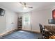 Neutral bedroom with closet, ceiling fan, and desk setup at 7409 Fiesta Way, Raleigh, NC 27615