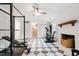 Home gym with exercise equipment, fireplace, and access to other rooms at 7409 Fiesta Way, Raleigh, NC 27615