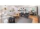 Spacious open-concept design with views of the kitchen and dining area, hardwood floors, and neutral decor at 7409 Fiesta Way, Raleigh, NC 27615