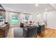 Bright living room with hardwood floors, large sectional sofa and two chairs at 7409 Fiesta Way, Raleigh, NC 27615