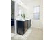 Double vanity bathroom with two sinks, mirrors, and great natural lighting from the window at 743 Silver Stream Ln, Cary, NC 27519