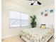 Inviting bedroom with natural light, featuring decorative artwork and leafy green plants at 743 Silver Stream Ln, Cary, NC 27519