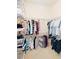 Walk-in closet with ample shelving and hanging space for organized storage at 743 Silver Stream Ln, Cary, NC 27519
