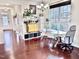 Dining area with hardwood floors, bright lighting, and view of the neighborhood at 743 Silver Stream Ln, Cary, NC 27519