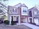 Inviting two-story townhome with a well-maintained lawn and attached one car garage at 743 Silver Stream Ln, Cary, NC 27519