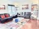 Cozy living room with comfortable leather furniture, stylish rug, and natural light at 743 Silver Stream Ln, Cary, NC 27519