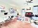 Spacious living room with ceiling fan, hardwood floors, desk, and comfortable seating at 743 Silver Stream Ln, Cary, NC 27519