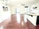 Living room and kitchen area with hardwood floors and bright lighting at 743 Silver Stream Ln, Cary, NC 27519