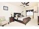 Main bedroom features a ceiling fan, decorative bedding, and windows at 743 Silver Stream Ln, Cary, NC 27519