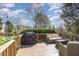 Spacious back deck features wooden railings, comfy seating, and a grill for outdoor enjoyment at 756 Rockville Rd, Wake Forest, NC 27587