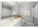 Neutral bathroom with a vanity, a large mirror, and tub and shower with curtain at 756 Rockville Rd, Wake Forest, NC 27587