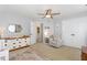 Spacious Bedroom with a dresser, changing table, sitting chair, and view to the ensuite bath at 756 Rockville Rd, Wake Forest, NC 27587
