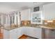 Bright kitchen with stainless steel appliances, granite countertops, and ample cabinet space at 756 Rockville Rd, Wake Forest, NC 27587
