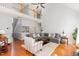 Spacious living room showcasing hardwood floors, an upper level view, and a cozy seating area at 756 Rockville Rd, Wake Forest, NC 27587