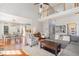 Bright and airy living room boasts hardwood floors, high ceilings, and seamless flow into the dining area at 756 Rockville Rd, Wake Forest, NC 27587