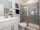 Stylish bathroom featuring a sleek vanity, a glass-enclosed shower with elegant tile, and modern fixtures at 781 Cormiche Ln, Wake Forest, NC 27587