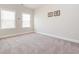 Bright, airy bedroom featuring neutral walls, plush carpet, and plenty of natural light at 781 Cormiche Ln, Wake Forest, NC 27587