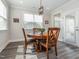 Dining area features a wooden table, chairs, pendant lighting, and natural light at 781 Cormiche Ln, Wake Forest, NC 27587