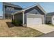 View of a one car detached garage with blue siding at 781 Cormiche Ln, Wake Forest, NC 27587
