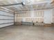 View of inside of a one car garage with ladder and unfinished walls at 781 Cormiche Ln, Wake Forest, NC 27587