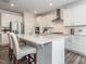 Contemporary kitchen featuring a large island, modern appliances, and stylish seating, great for cooking and entertaining at 781 Cormiche Ln, Wake Forest, NC 27587