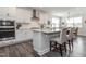Bright kitchen with white cabinets, quartz countertops, and stainless steel appliances, perfect for culinary enthusiasts at 781 Cormiche Ln, Wake Forest, NC 27587