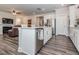 Modern kitchen with a center island, stainless steel appliances, and an open layout for easy entertaining at 781 Cormiche Ln, Wake Forest, NC 27587