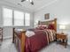 Cozy main bedroom featuring neutral walls, plush carpet, and a large window for natural light at 781 Cormiche Ln, Wake Forest, NC 27587