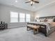 Inviting bedroom featuring tray ceiling, neutral color palette, and lots of natural light at 781 Cormiche Ln, Wake Forest, NC 27587