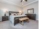 Well-lit bedroom with plush carpet, furnishings, and a large mirror over dresser at 781 Cormiche Ln, Wake Forest, NC 27587