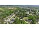 Expansive aerial view of a charming neighborhood surrounded by lush greenery and mature trees at 8016 Parker Mill Trl, Fuquay Varina, NC 27526