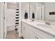 Bathroom with a white double sink vanity, tiled floor, and view of shower and toilet at 8016 Parker Mill Trl, Fuquay Varina, NC 27526