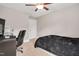 Bedroom features carpet flooring, a modern desk and chair, and a comfortable bed at 8016 Parker Mill Trl, Fuquay Varina, NC 27526