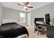 Bedroom featuring a ceiling fan, carpet flooring, a modern desk and chair, and comfortable bed at 8016 Parker Mill Trl, Fuquay Varina, NC 27526