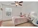 Bright bedroom with a white bed frame, a cute panda, and a stylish white nightstand at 8016 Parker Mill Trl, Fuquay Varina, NC 27526