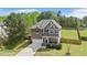 Charming two-story home featuring a manicured lawn and a welcoming front porch at 8016 Parker Mill Trl, Fuquay Varina, NC 27526