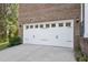 Spacious two-car garage with a stylish white door and ample driveway space at 8016 Parker Mill Trl, Fuquay Varina, NC 27526